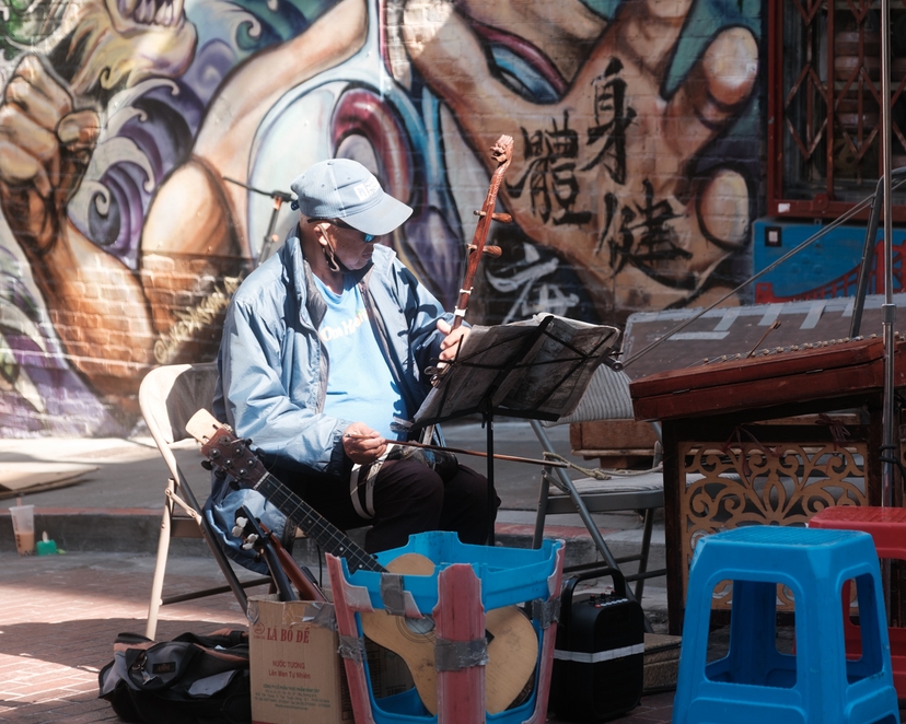 A man performing in the Street - Chinatown, San Francisco, CA